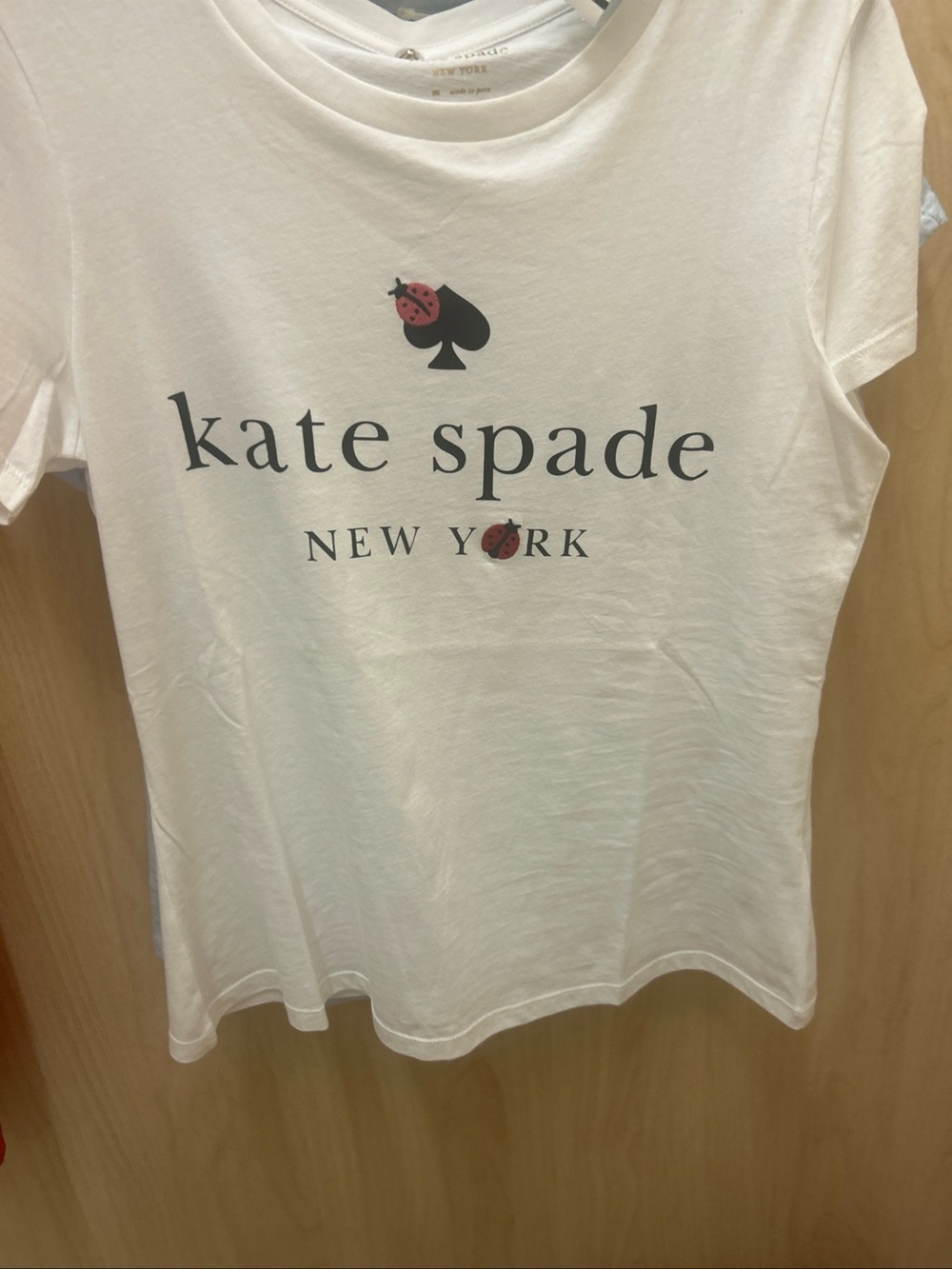 KATE SPADE White Tee with Black Logo and Red Ladybug Accents